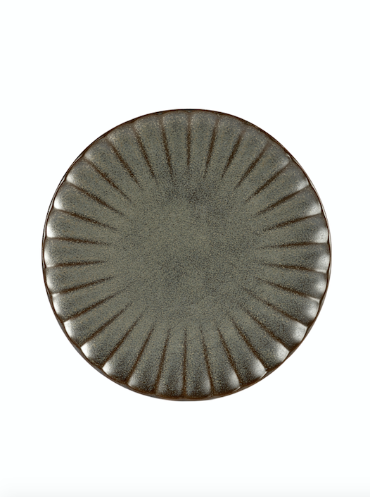 flaches Teller mit Rillen wie die Sonne von Oben